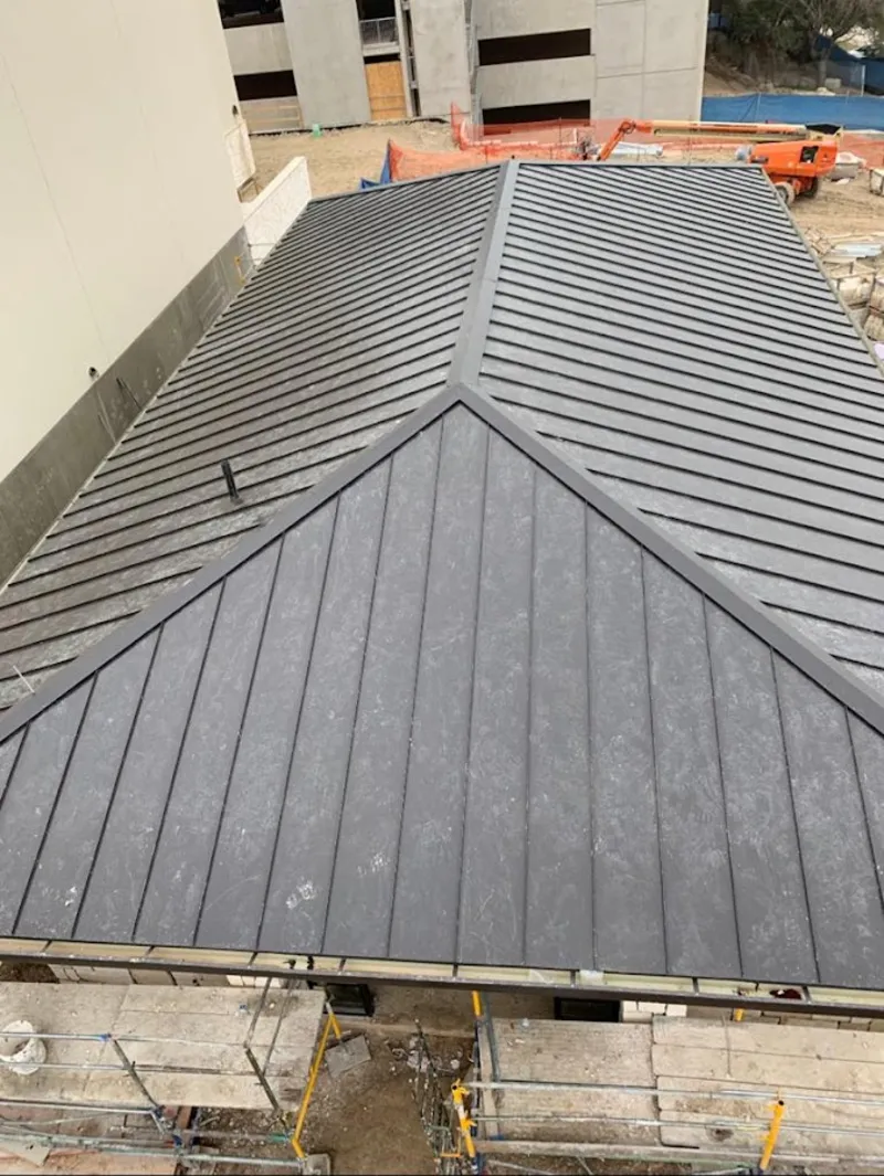 Commercial metal roof construction with crane equipment in Prairie du Chien