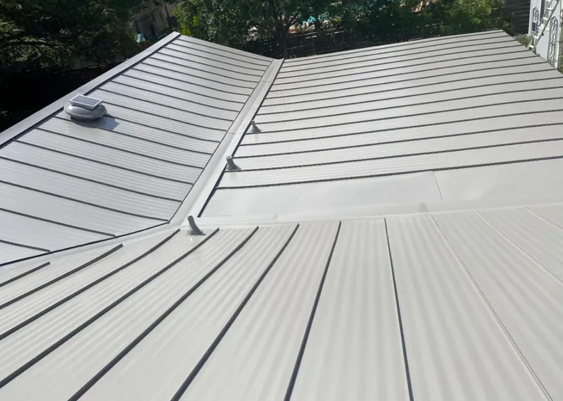 Solar attic fan installed on a metal roof for Roof Ventilation in Prairie du Chien